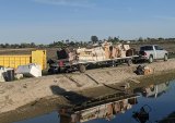 Volunteers with Reestablishing Stratford began the process of cleaning up an unwanted and illegal dump site near the small community of Stratford.